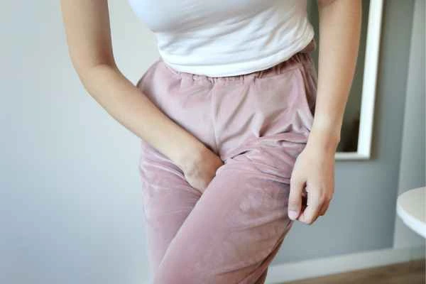 older woman running to the toilet because of urinary incontinence Gloucestershire